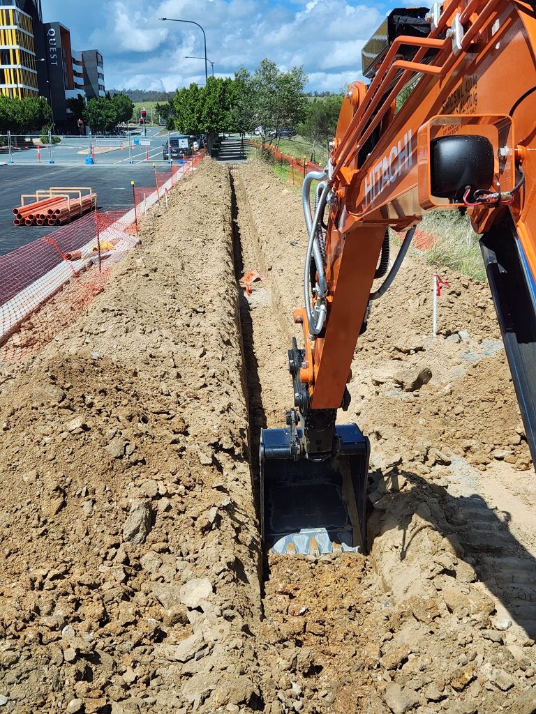 earthmoving and excavation services digging a trench